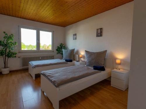 Ένα ή περισσότερα κρεβάτια σε δωμάτιο στο Bookandstay24 Rossdorf bei Darmstadt, Frankfurt, Rhein Main Gebiet