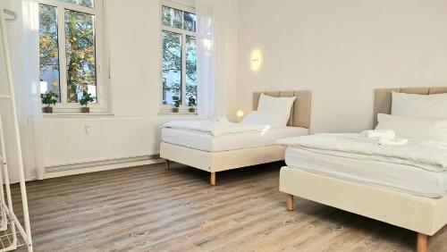 Postel nebo postele na pokoji v ubytování 122qm-Apartment - 4 Zimmer I Zentral I Küche I Balkon I Parken I WLAN