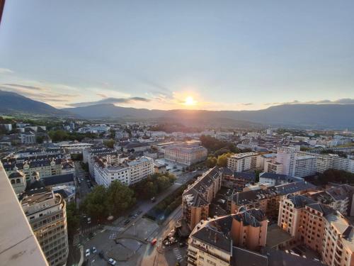 an aerial view of a city at sunset at Sommet Centenaire Hyper-centre in Chambéry