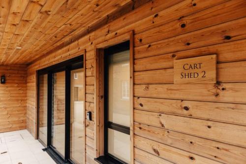 a building with a sign that reads car shed at Cart Shed 2 in Nuneham Courtenay