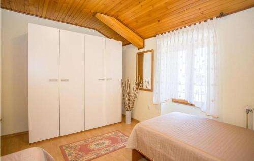 Ένα ή περισσότερα κρεβάτια σε δωμάτιο στο Villa Maria