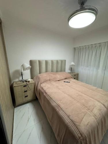 Ένα ή περισσότερα κρεβάτια σε δωμάτιο στο Alquiler Temporario Necochea