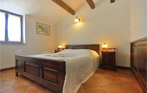 a bedroom with a large bed and two night stands at Adorata 1 in Labin