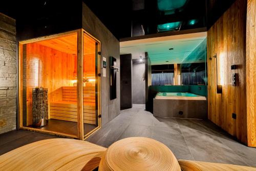 a large bathroom with a large tub at Czorsztyn Prestige Osada in Czorsztyn