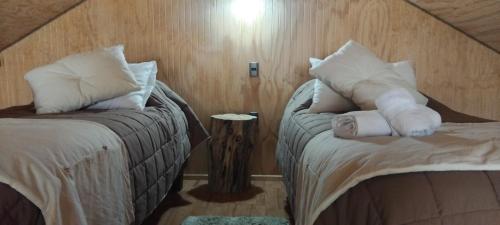 Postel nebo postele na pokoji v ubytování Cabañas Lodge Patagonia truful