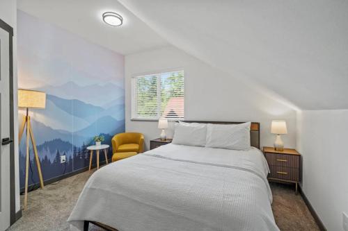 a bedroom with a bed and a yellow chair at Forest Haven in Ashford