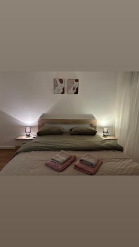 a bedroom with a bed with two towels on it at Residency appartment in Danilovgrad
