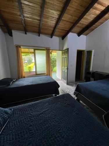 Postel nebo postele na pokoji v ubytování Hotel Villa Bosco