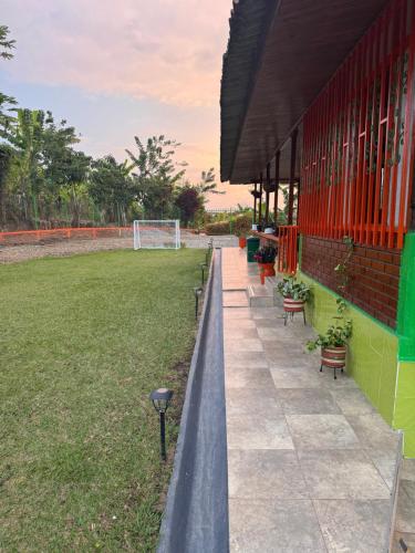 a building with a soccer field and a goal at Finca La Gaviota in Montenegro
