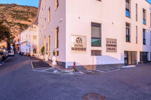 a street with buildings and a fire hydrant on the street at Panorama Palace Hotel in Meta