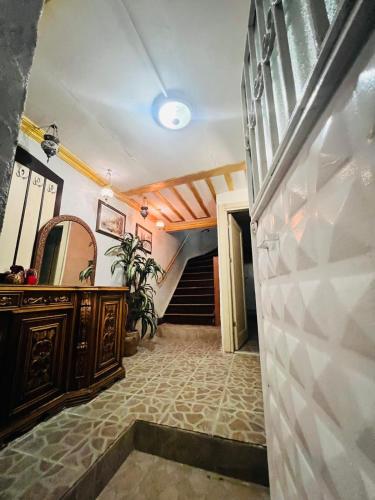 a room with a staircase with a mirror and a staircase at DEDENİN YERİ İSTANBUL in Istanbul
