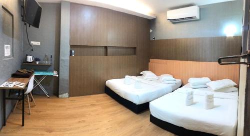 Katil atau katil-katil dalam bilik di LE dEON HOTEL Former Pine Hotel