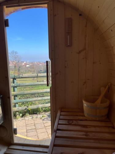 an inside view of a wooden room with a window at Il Bosco Incantato in Borgo San Dalmazzo