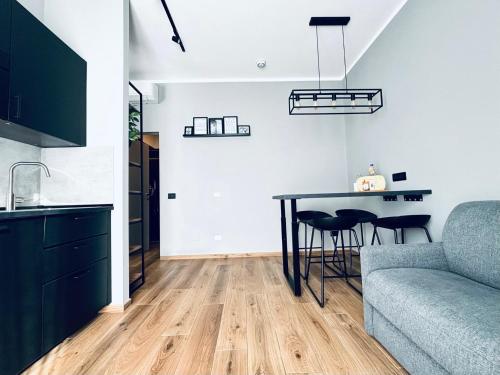 Posezení v ubytování M4 BLACK Monolocale Moderno e Funzionale