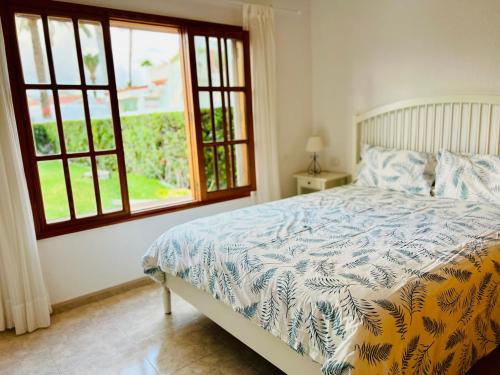 En eller flere senge i et værelse på Arena y mar