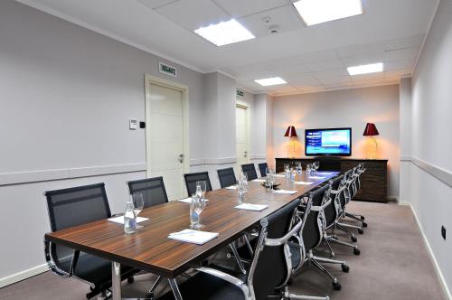a large conference room with a long table and chairs at CRYSTAL Hotel Belgrade in Belgrade