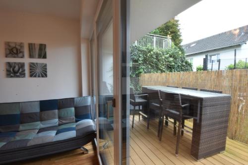 a balcony with a table and chairs and a fence at Home Maislinger - Enjoy Nature, Explore Salzburg in Wals
