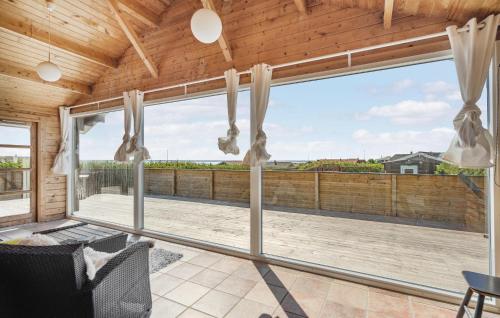a view from the living room of a house with a large window at Stunning Home In Vinderup With Kitchen in Vinderup
