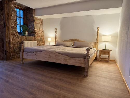 a bedroom with a bed in a room at Ferienwohnung Burg Hausen in Heimbach