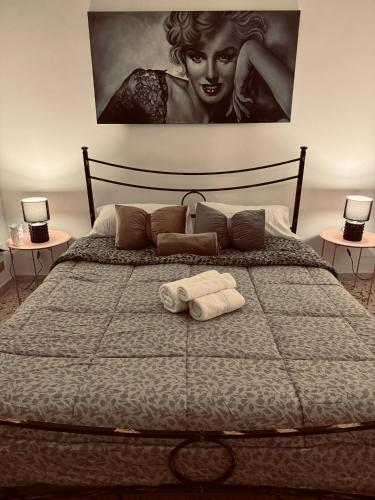 a bedroom with a bed with two towels on it at Giovanna Home in Marsala