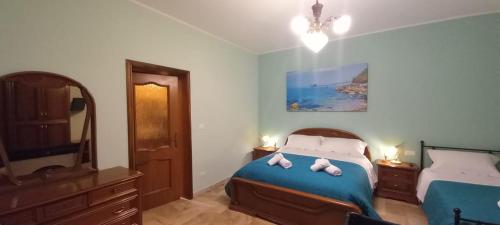 a bedroom with a bed with two stuffed animals on it at La Magnolia - Locazione Turistica in Manoppello
