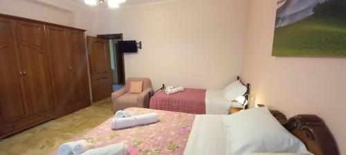 a bedroom with a bed and a chair in it at La Magnolia - Locazione Turistica in Manoppello