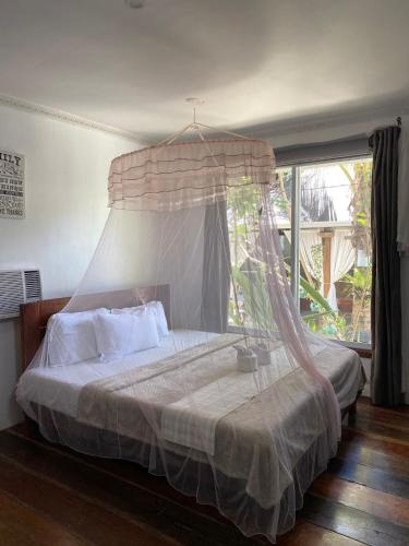 Postel nebo postele na pokoji v ubytování Siargao Residency by Privacy Group