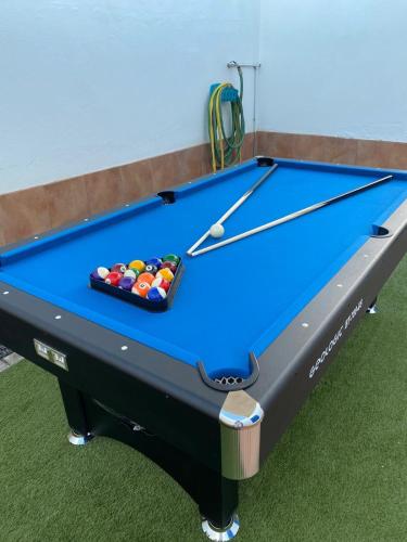 a blue pool table with a tray of balls at Villa Maiteren Etxea- 4 Beds property with private pool in Playa Blanca