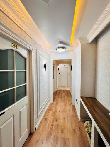a hallway of a house with a yellow line on the ceiling at Pembe Köşk Old City Center in Istanbul
