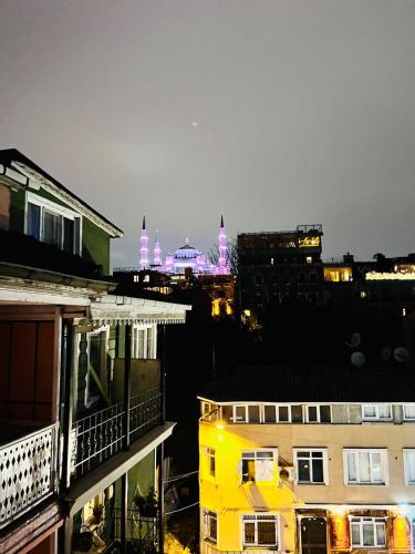 a view of a city at night with purple lights at Pembe Köşk Old City Center in Istanbul
