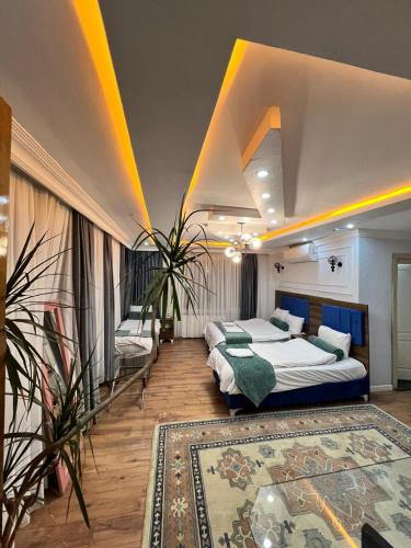 a bedroom with two beds and a rug at Pembe Köşk Old City Center in Istanbul
