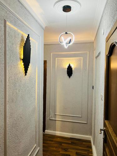 a hallway with a white door and a light at Pembe Köşk Old City Center in Istanbul