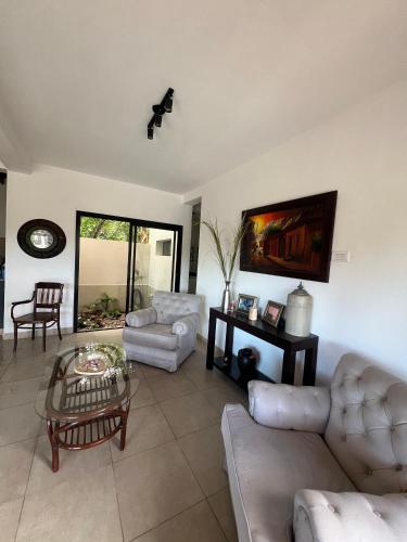 a living room with two couches and a table at Casa Garcia in Salta