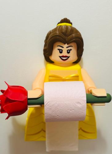 a lego man holding a roll of toilet paper at THE ENCHANTED HOUSE ( 15 min walk to Disney) in Serris