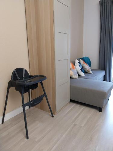 a small room with a bed and a chair at Home 120, Mansion Alhamar in Sitio de Calahonda