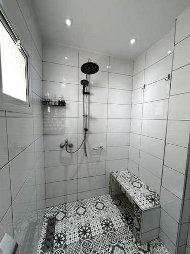 a bathroom with a shower with a tiled floor at Modern appartement in Agadir in Agadir