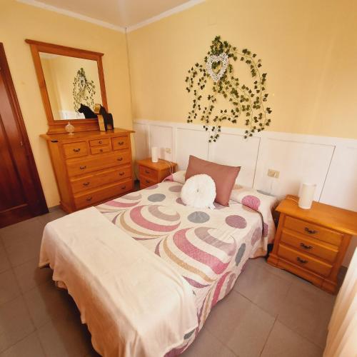 a bedroom with a bed with a stuffed animal on it at Chalet Playa Chilches in Chilches