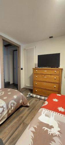 Cama o camas de una habitación en Appartamento EDELWEISS