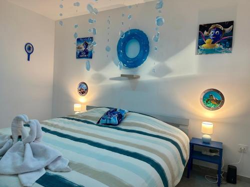 a bedroom with a bed with towels on it at Europ-Appart --- Europa-Park-Rulantica in Huttenheim