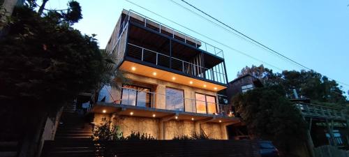 a building with stairs leading up to it at Casa Mirador in Quintero