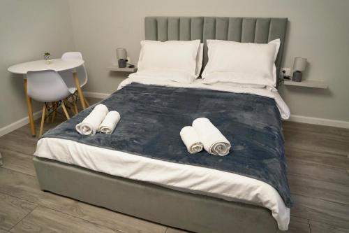 Postel nebo postele na pokoji v ubytování Arni's Apartments