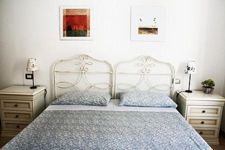 a bedroom with a bed and two night stands at Residence Bizzoni in Terni