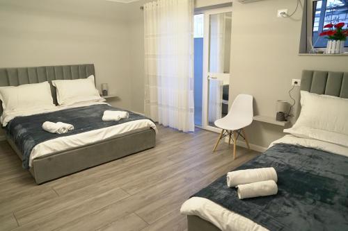 Postel nebo postele na pokoji v ubytování Arni's Apartments