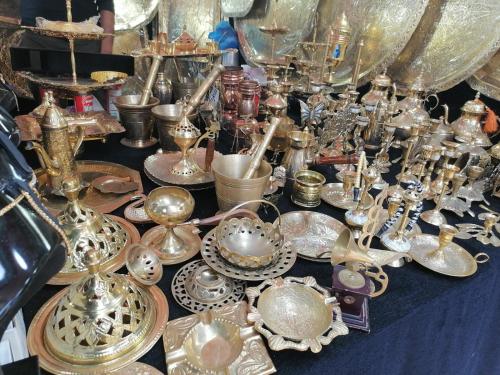 a table with a bunch of glass items on it at Belle vue à Bel air in Oran