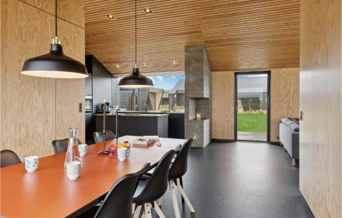 a dining room and kitchen with a table and chairs at Gorgeous Home In Jerup With Wifi in Jerup