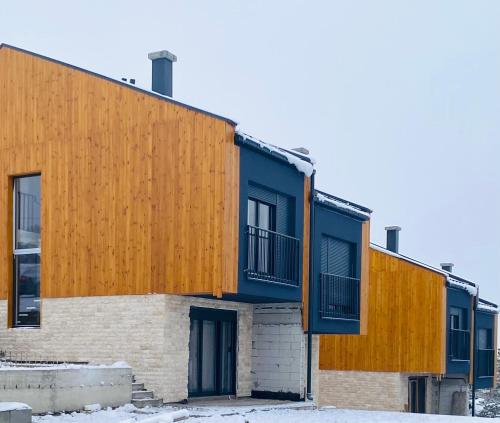 an exterior view of a building with blue and orangeiding at Tornik view villa Zlatibor 2 in Ribnica