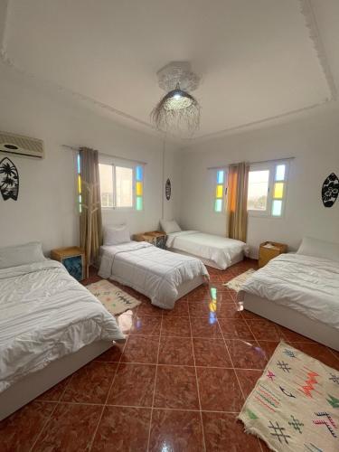 Una cama o camas en una habitación de Freebird Hostel