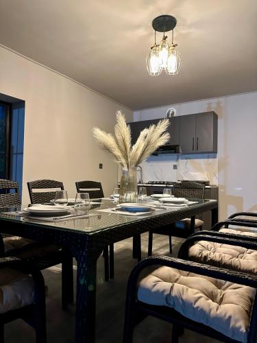 a dining room with a table and chairs at Blueberryhouse in İsmayıllı