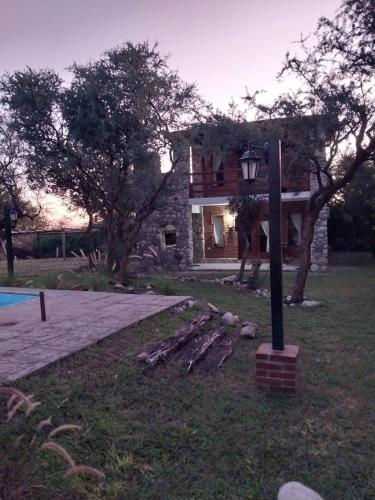 a house with a street light in front of it at soy ahora 1 y 2 in Pueblito