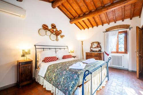 a bedroom with a bed and a window at Borgo la Pieve in Florence